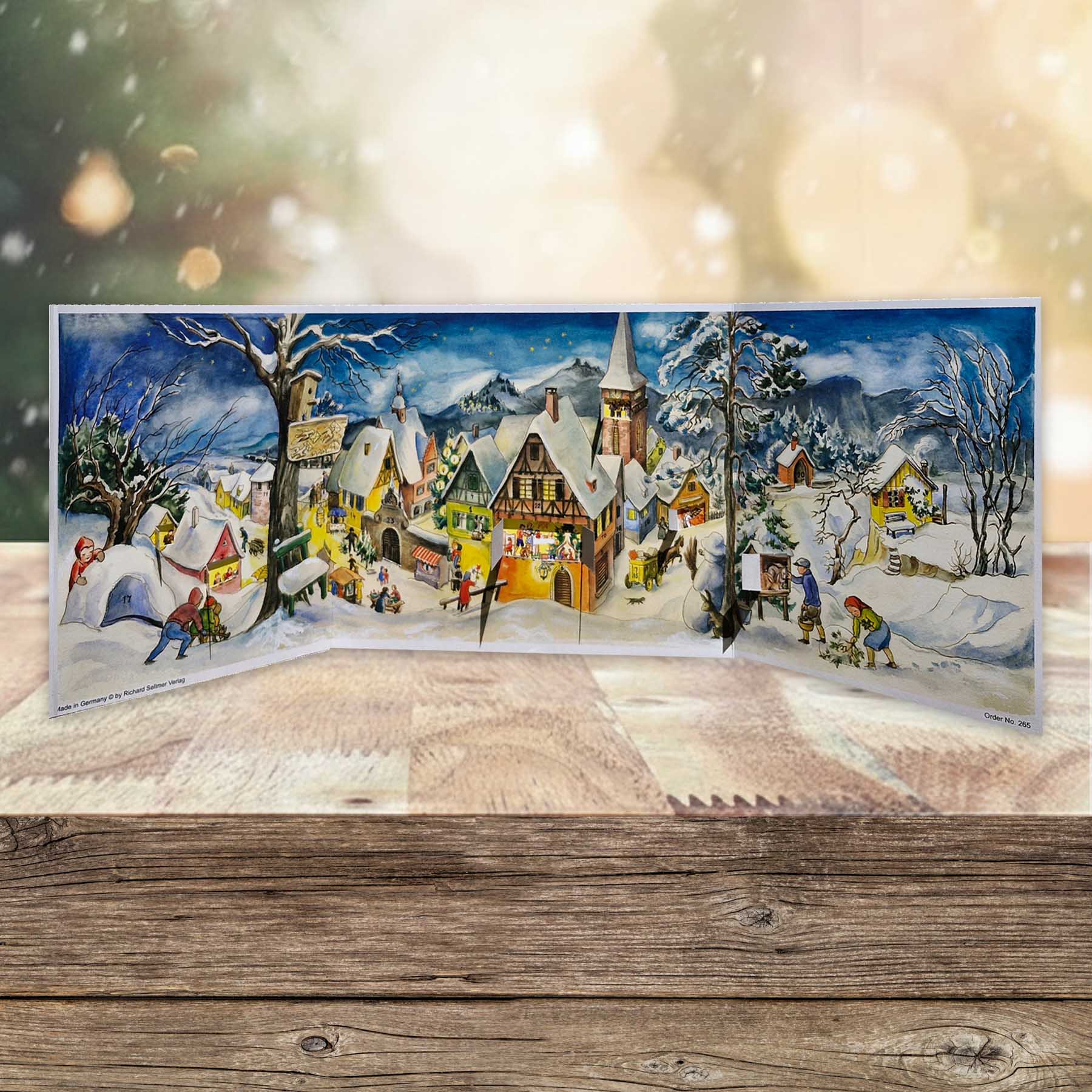 Adventskalender kleines Dorf im Winter aufgestellt