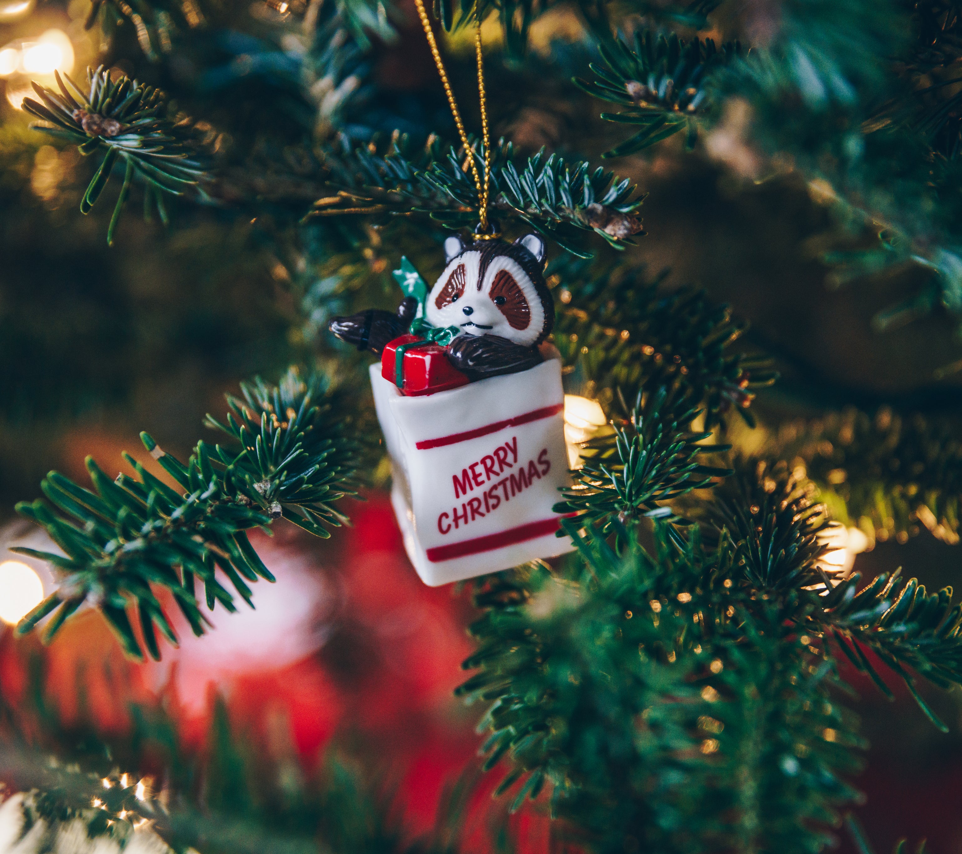 Merry christmas ornament on tree